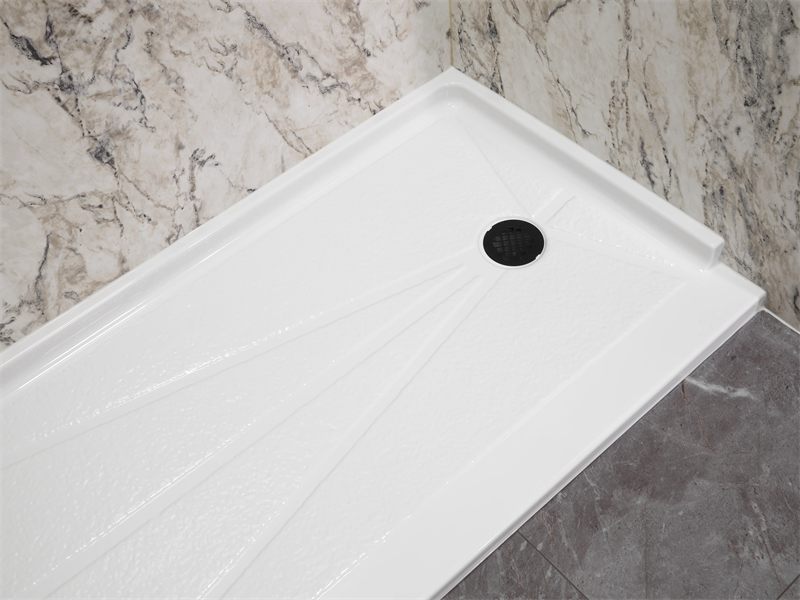 Low-threshold shower base against veined marble-look wall panels
