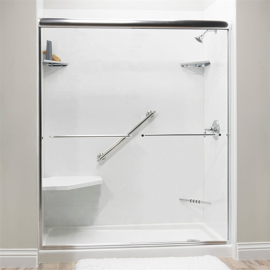 Accessible shower with a folding seat and chrome grab bars on white walls